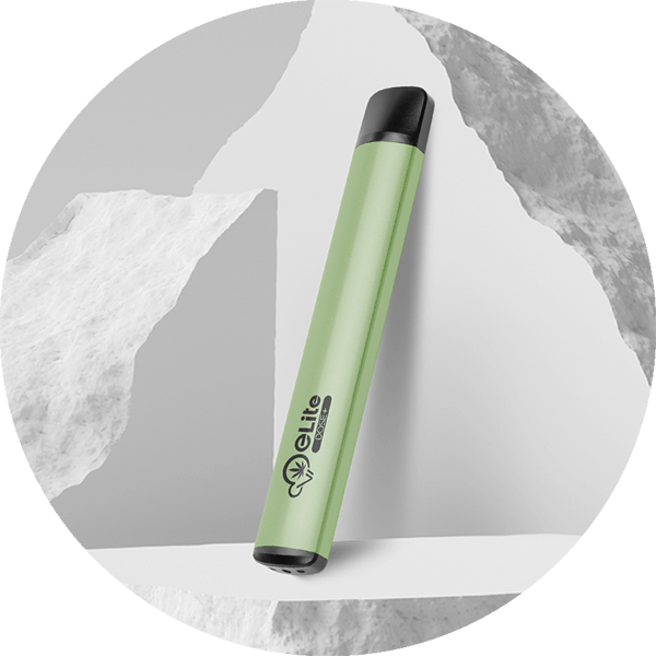 Green eLite Dose+ CBD Vape Pen On White and Grey Torn Background